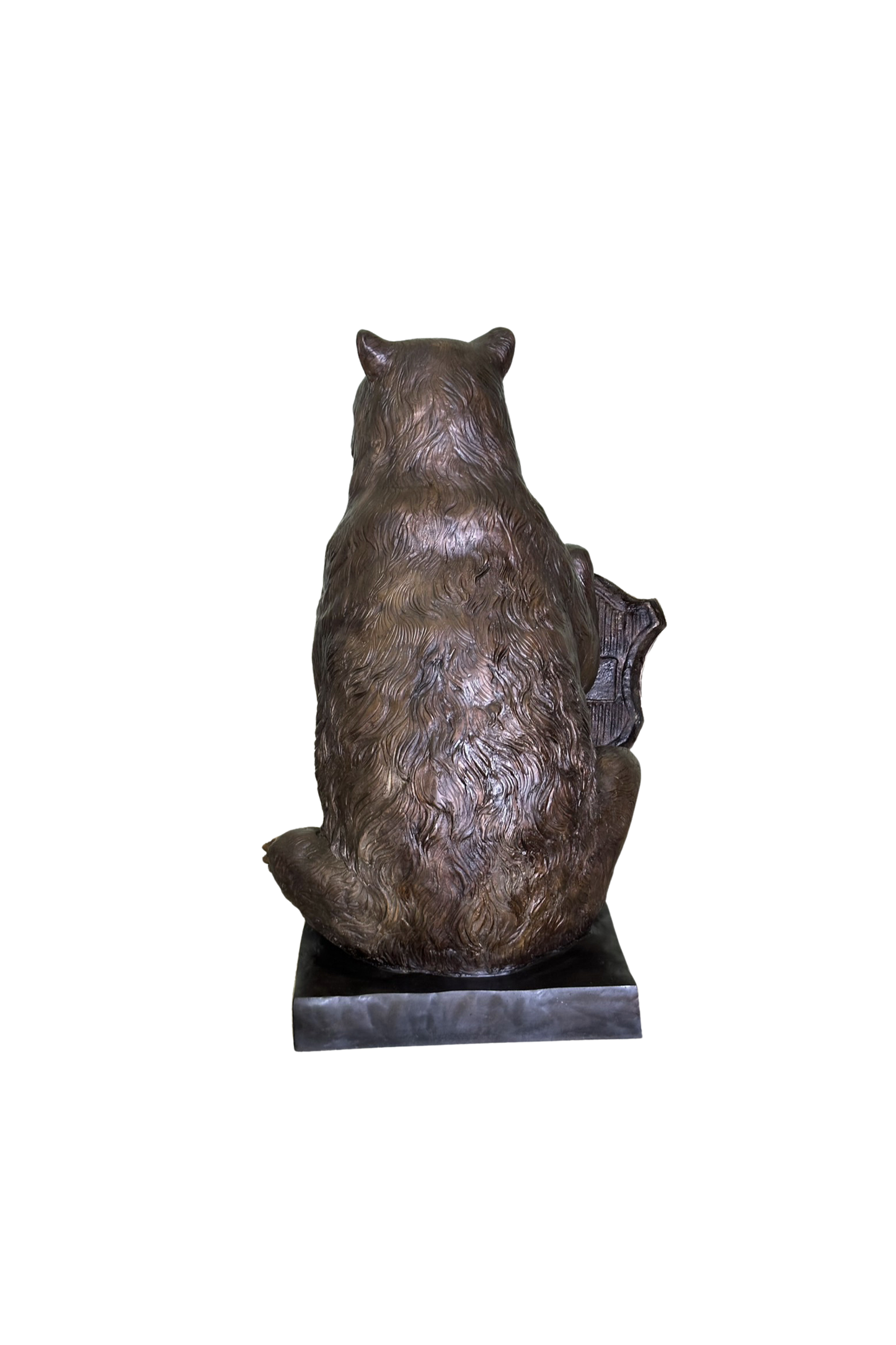 Bronze statue of a bear on a white background