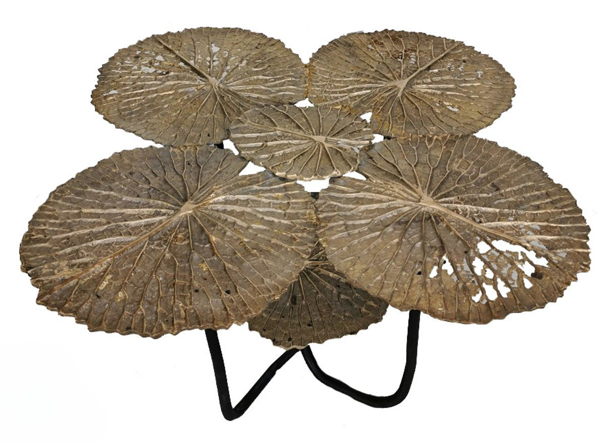 Decorative table with leaf-like designs on a white background
