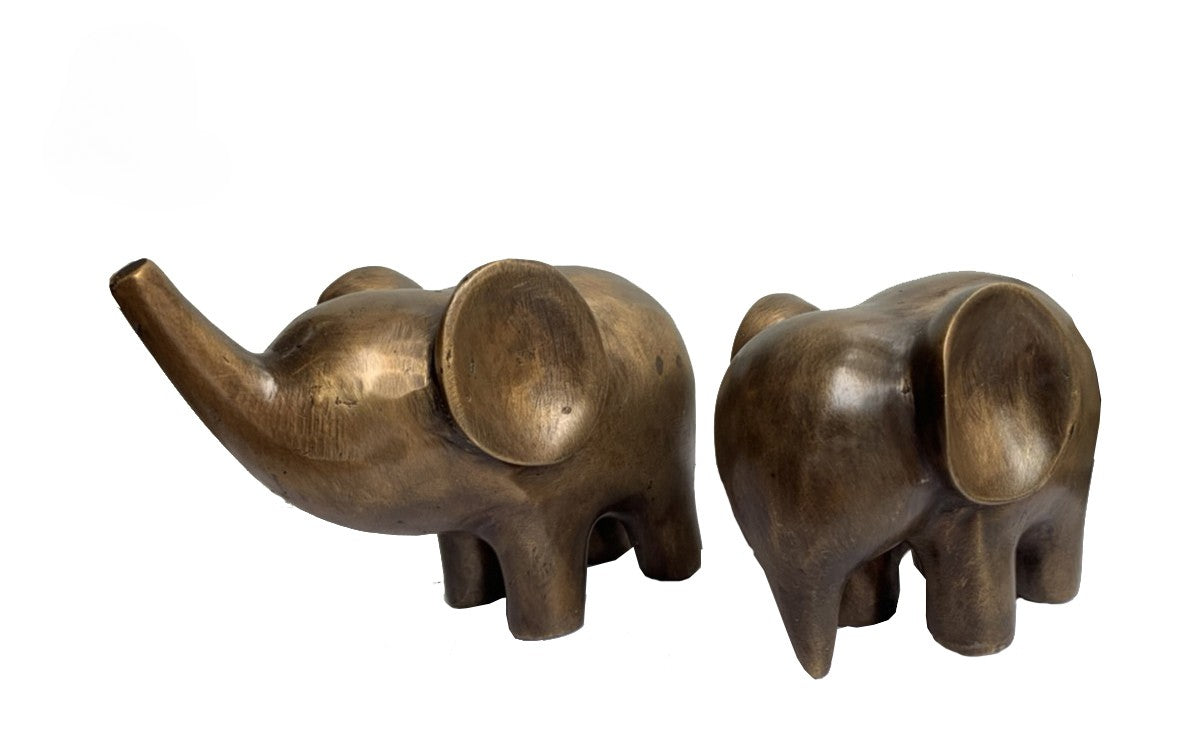 Two bronze elephant sculptures on a white background
