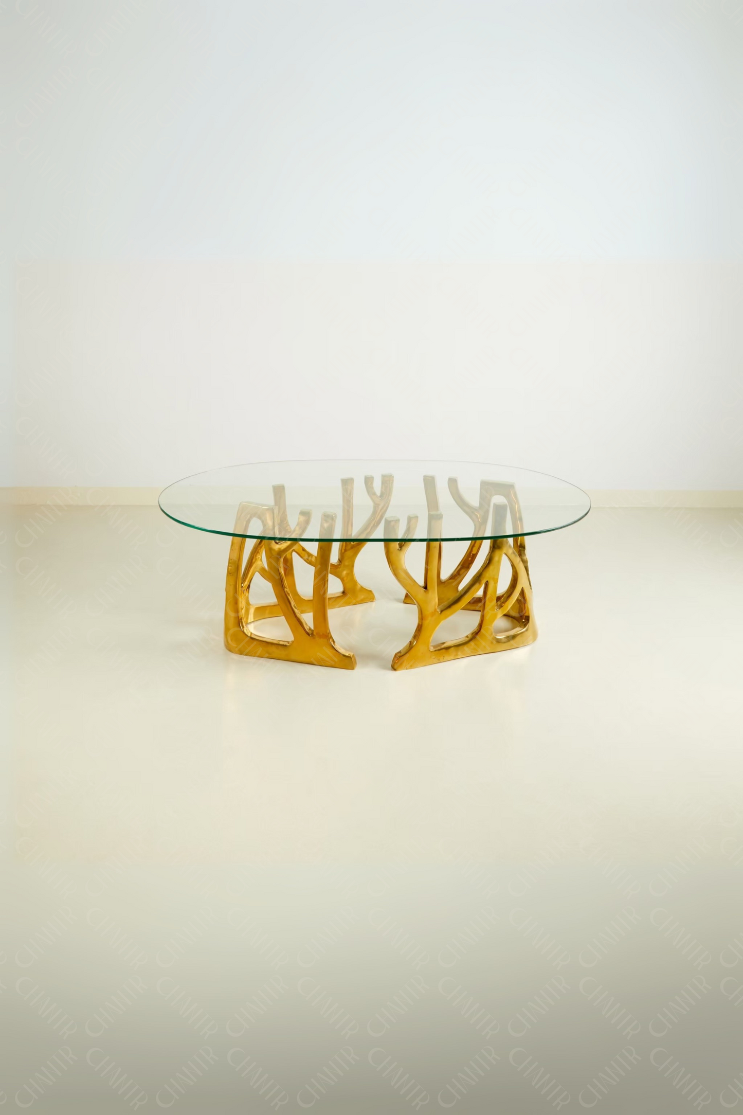 Glass table with gold brass luxury handmade furniture base, perfect for modern luxury decor, on a white background.