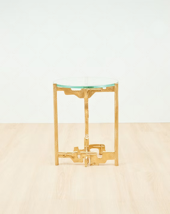 Side angle - Gold brass luxury handmade furniture side table with glass top, perfect for modern luxury decor, on a beige surface with white background.