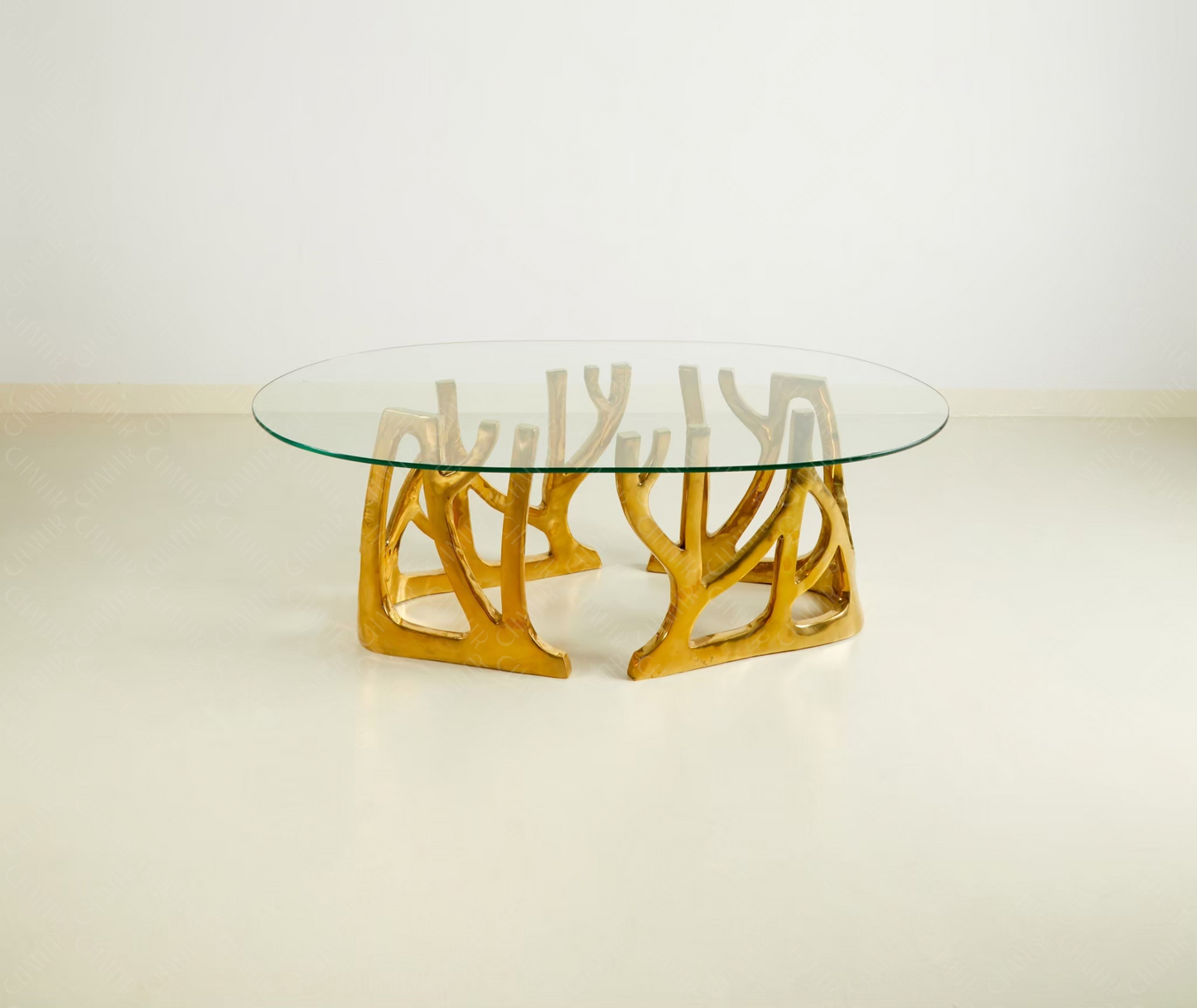 Glass table with gold brass luxury handmade furniture base, perfect for modern luxury decor, on a white background.