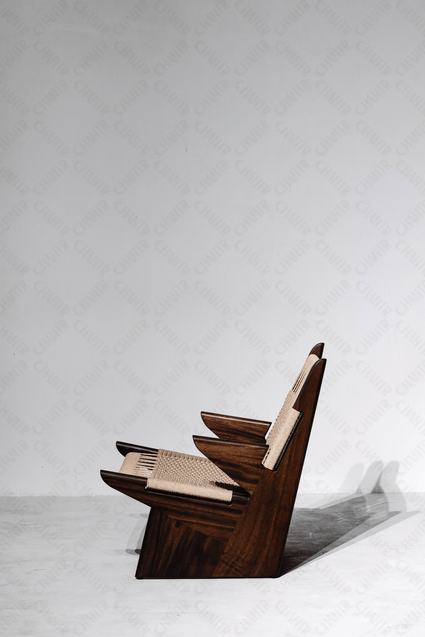 Full left side angle -Woven luxury handmade furniture chair with acacia wood frame, perfect for modern luxury decor, on a white background.