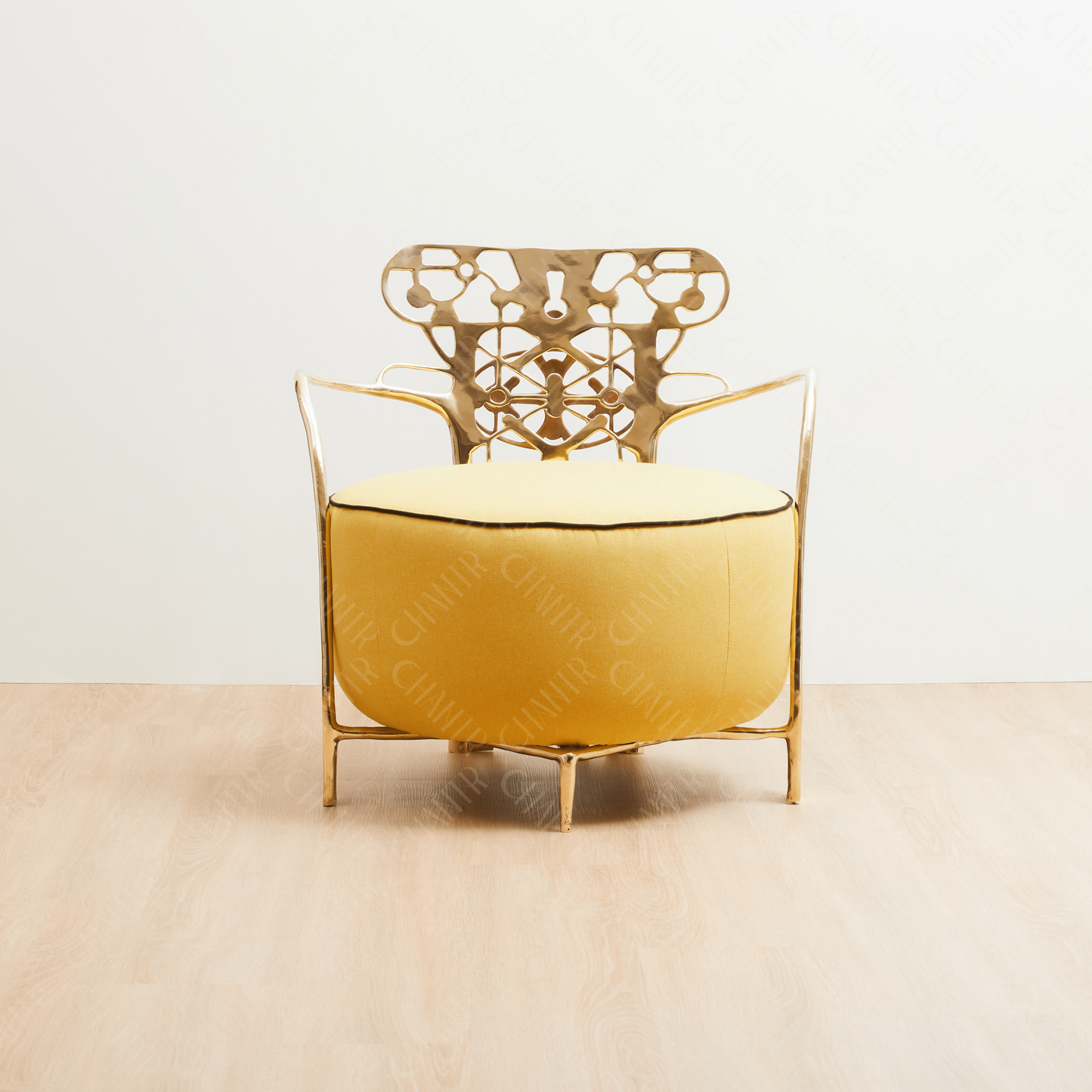 Decorative gold brass luxury handmade furniture chair with intricate metal frame, and yellow cushion ideal for modern luxury decor, on a white background. - straight angle