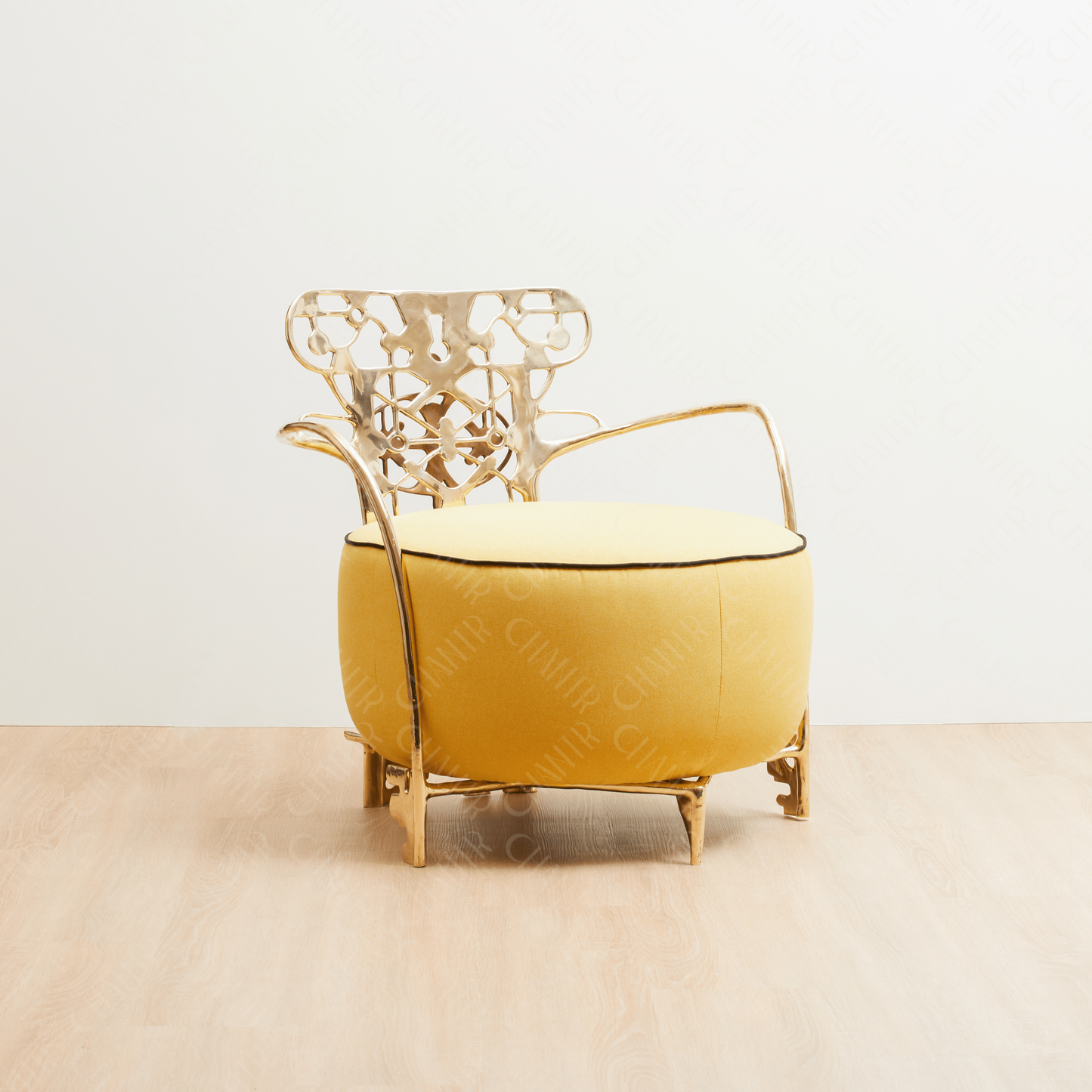 Decorative gold brass luxury handmade furniture chair with intricate metal frame, and yellow cushion ideal for modern luxury decor, on a white background. - side angle