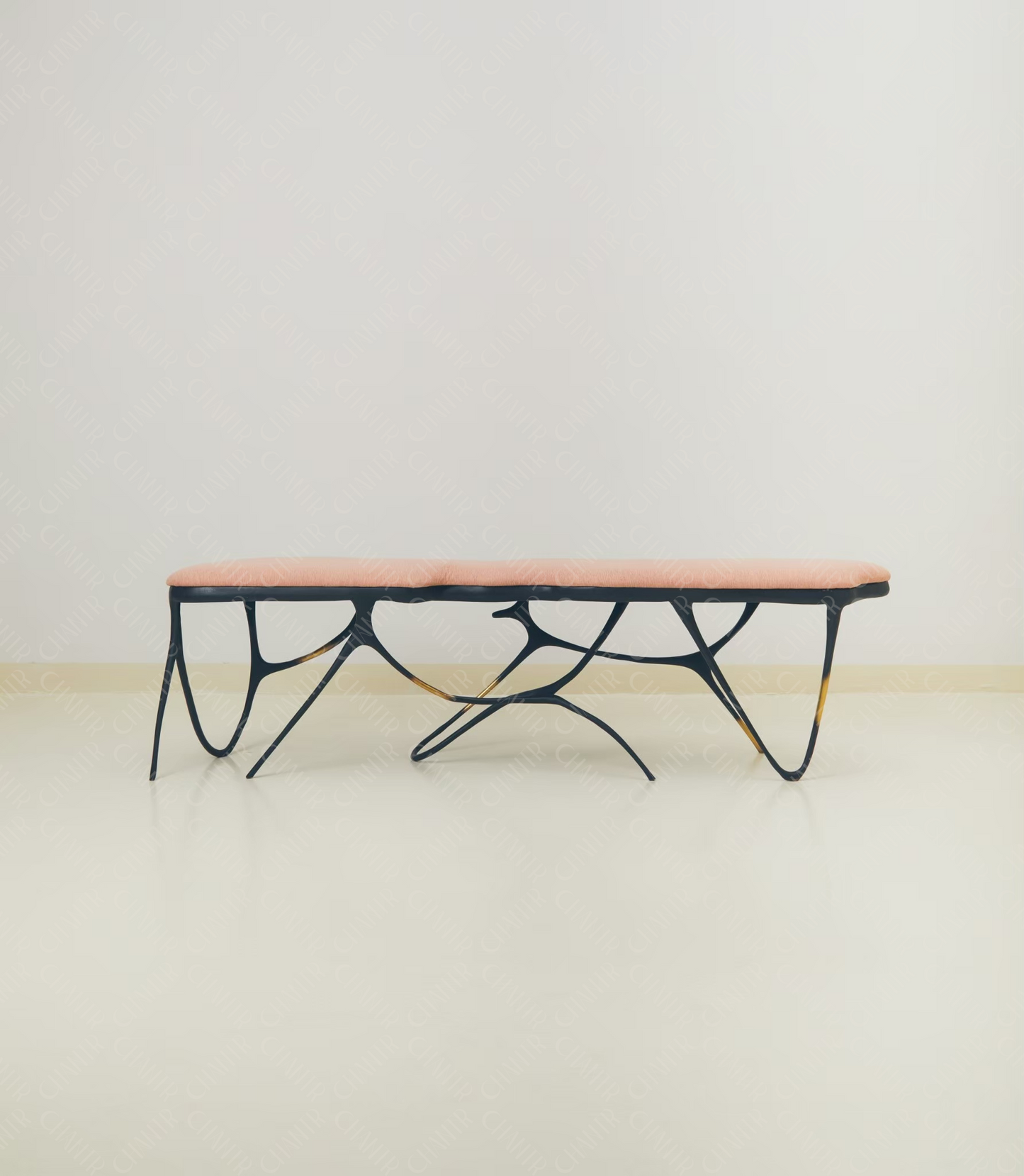 Modern luxury handmade furniture coffee table with black metal frame and pink top, brass furniture accents, perfect for modern luxury decor, on a plain background.