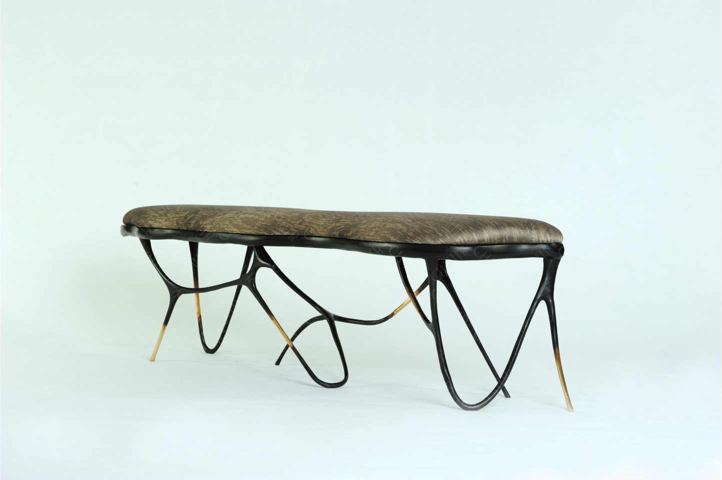 Black brass luxury handmade furniture bench with brown pattern cushion with modern design, ideal for modern luxury decor, on a white background. Side angle