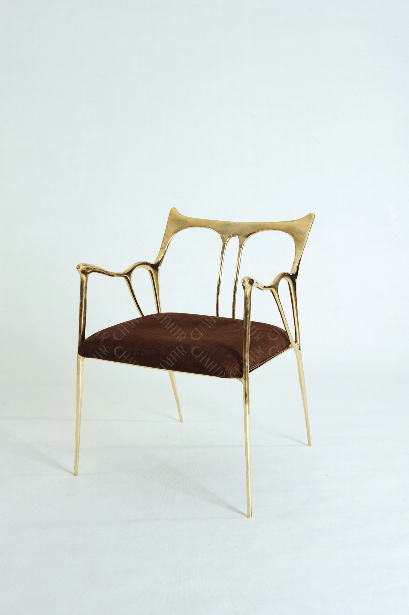 Gold brass luxury handmade furniture chair with brown cushion, ideal for modern luxury decor, on a wooden floor.
