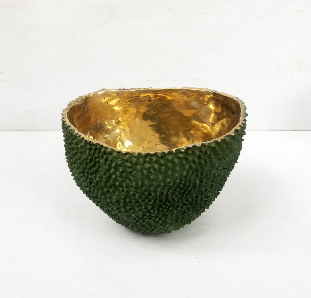 Decorative luxury handmade furniture bowl with green textured exterior and gold brass interior, perfect for modern luxury decor, on a white background.