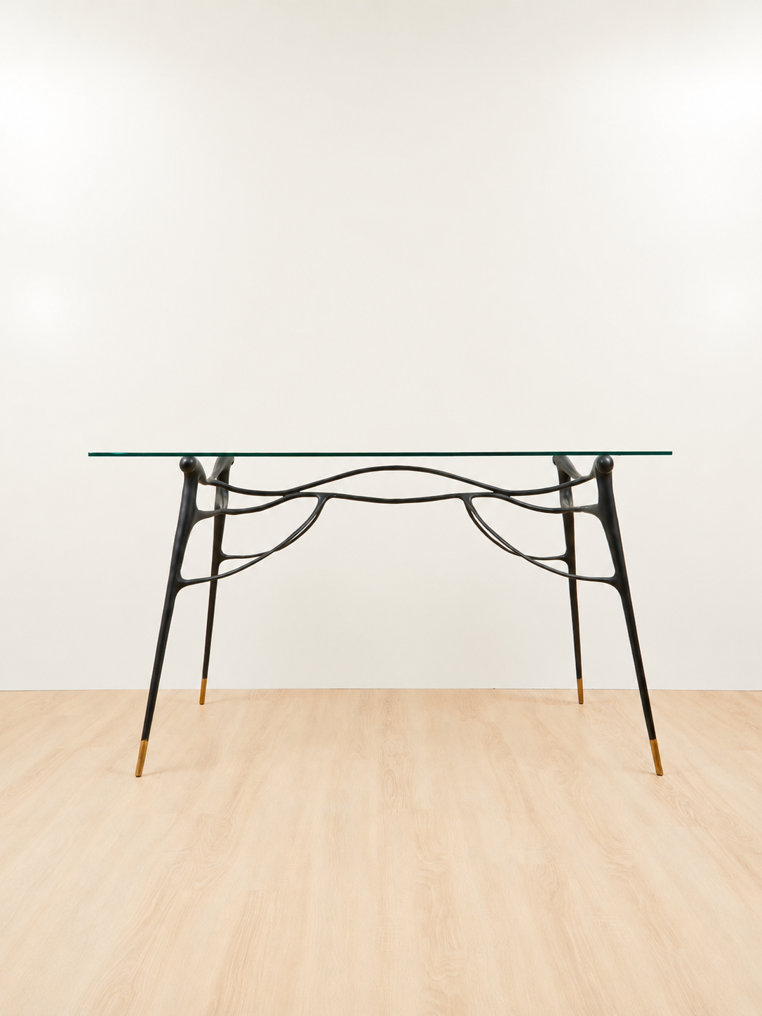 Glass dining table with black base. 