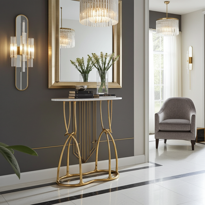 luxury handmade brass console table in gold with marble top in a stylish room with a mirror and chair.