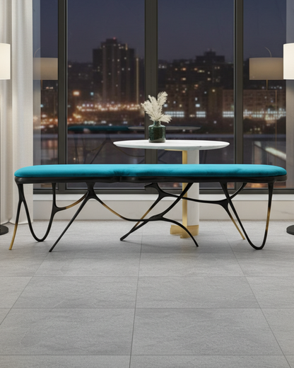 luxury handmade brass bench with turquoise cushion in a modern living room.
