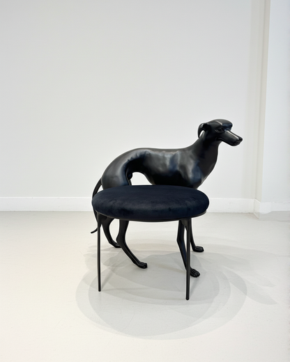 luxury handmade Black brass dog-shaped chair with a cushion on a white background