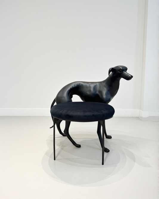 luxury handmade Black brass dog-shaped chair with a cushion on a white background