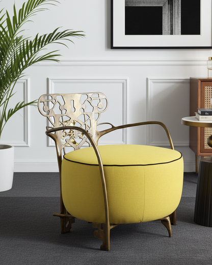 polished brass chair with gold frame in a modern room setting