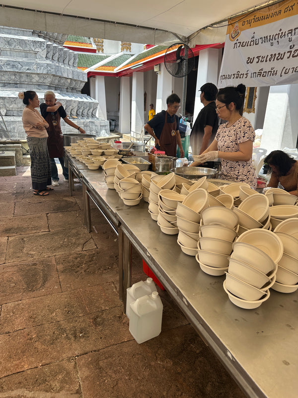 Serving food at temple with charitable foundation.