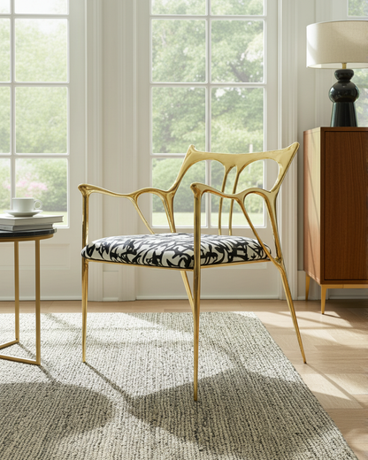 luxury handmade gold brass chair with patterned cushion on a stripped carpet. 