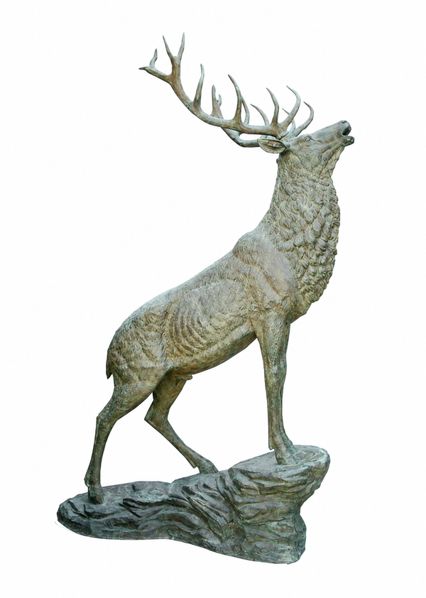 A detailed bronze sculpture of a elk with large antlers standing on a rocky base, isolated on a white background.