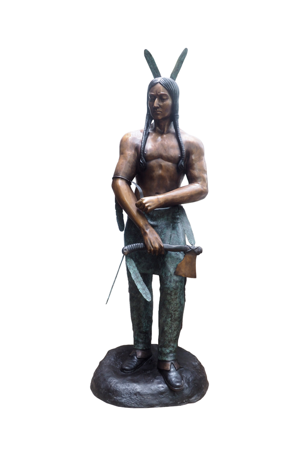 Bronze statue of a Native American figure with long hair and traditional attire on a white background