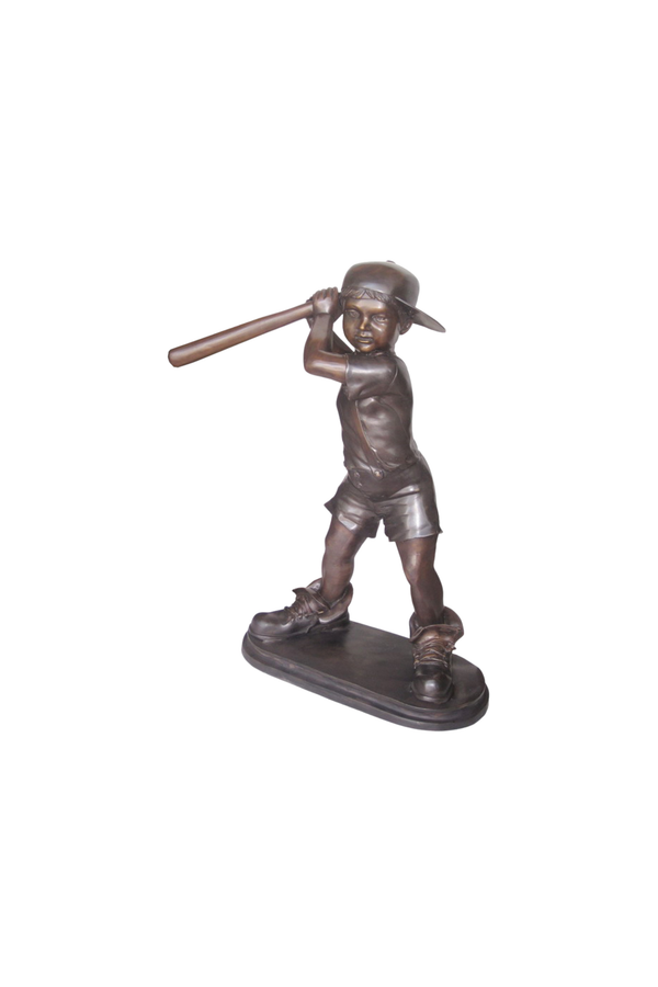 Bronze statue of a boy holding a baseball bat on a white background