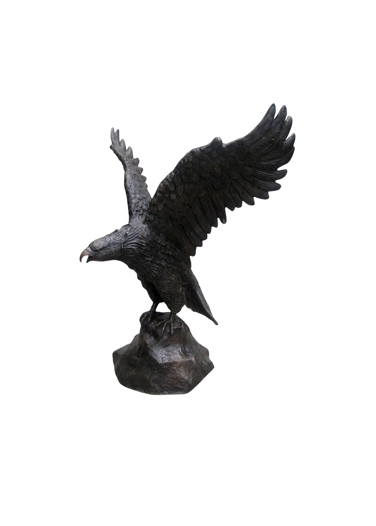 Bronze statue of an eagle with outstretched wings on rock with white background