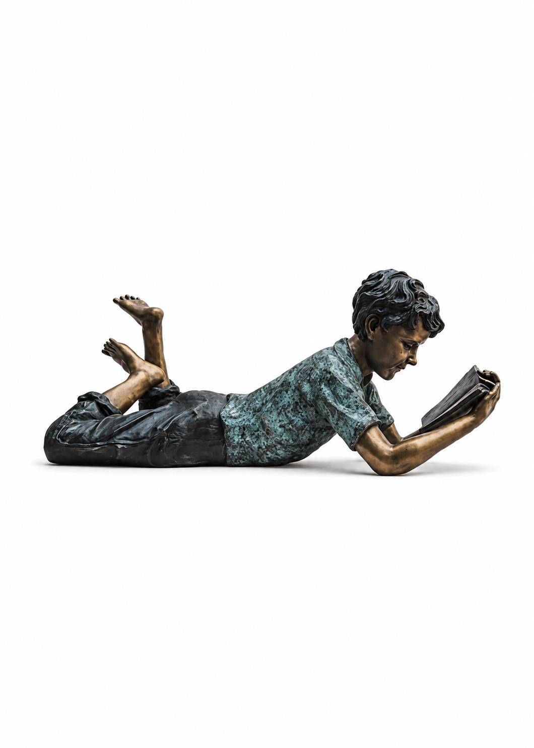 A bronze sculpture of a person lying down and reading a book, shown against a plain white background.