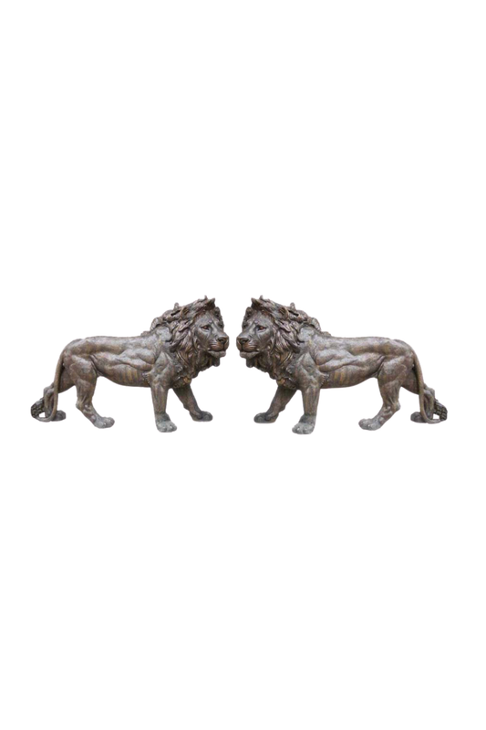 Two bronze lion statues on a white background