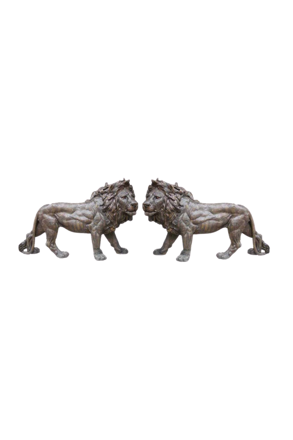 Two bronze lion statues on a white background