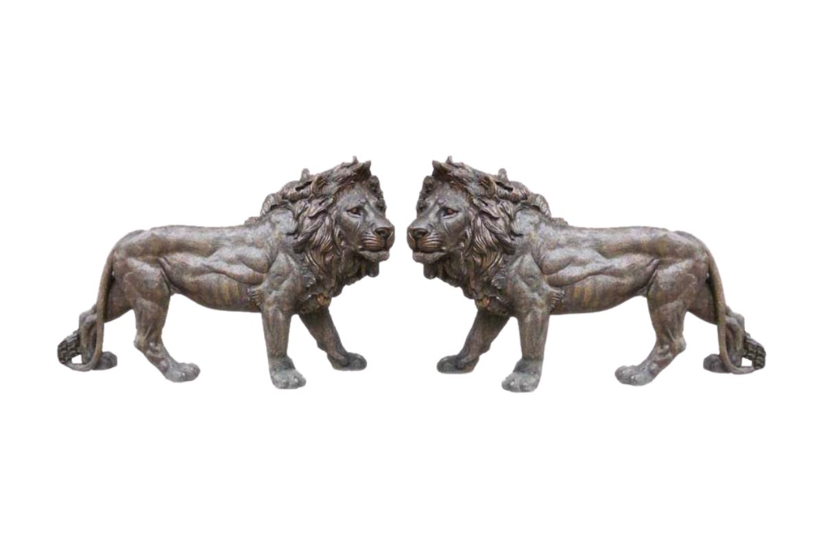Two bronze lion statues on a white background