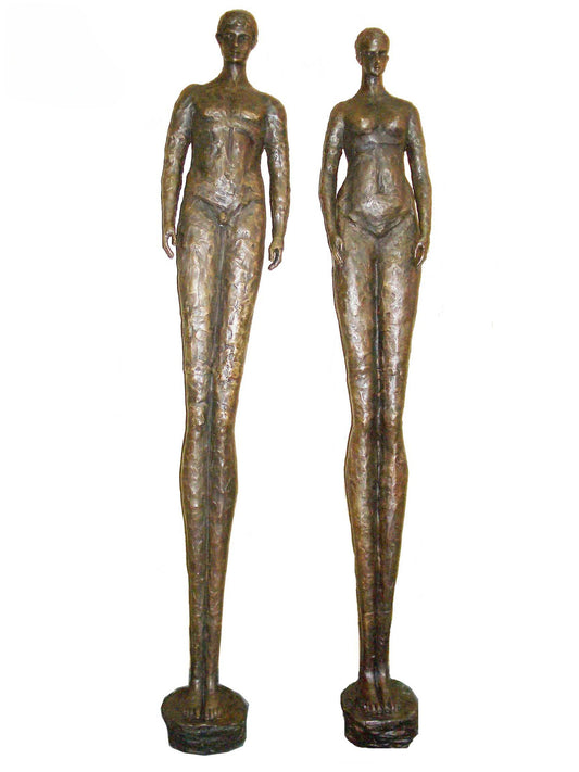 Two bronze luxury handmade furniture statues of standing figures, ideal for modern luxury decor, on a white background.