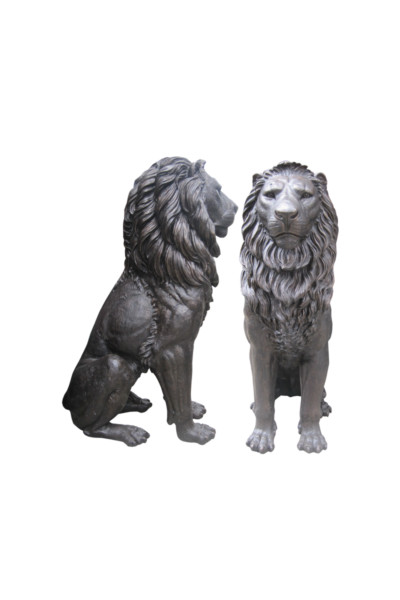 Two lion statues on a white background