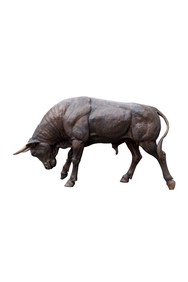 Bronze bull sculpture on a white background