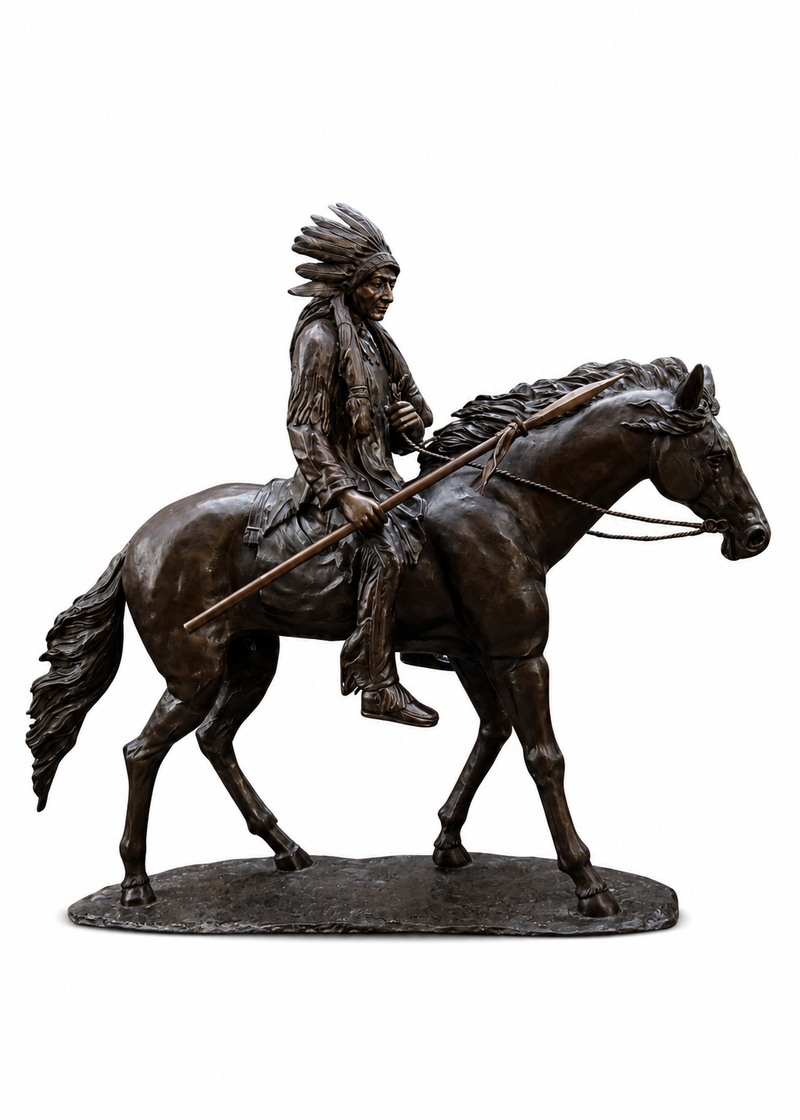 Bronze equestrian statue of a Native American rider on a horse, holding a spear, set on a textured base against a white background.