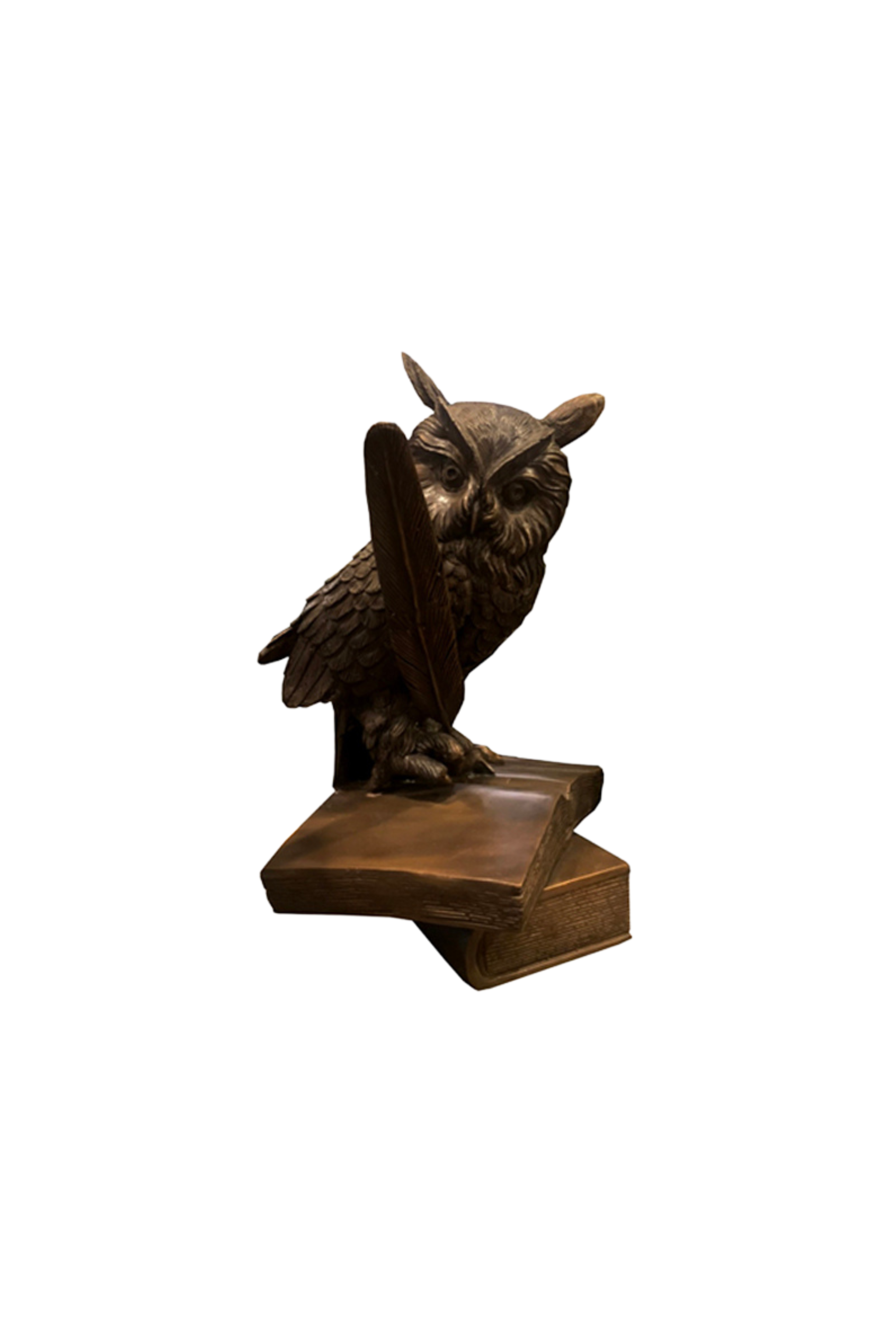 Bronze owl sculpture on a white background