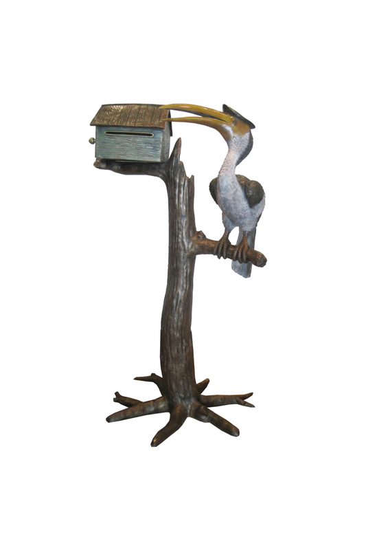 bronze mailbox with a toucan on a branch with a white background
