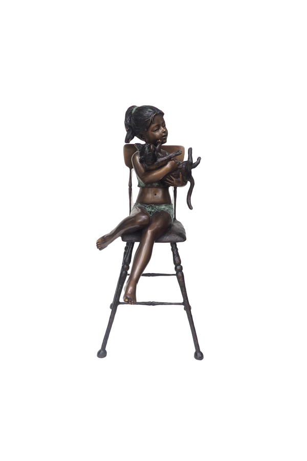 Bronze sculpture of a girl sitting on a stool with a white background