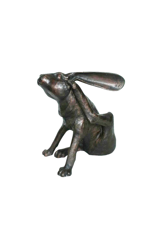 Bronze hare sculpture on a white background