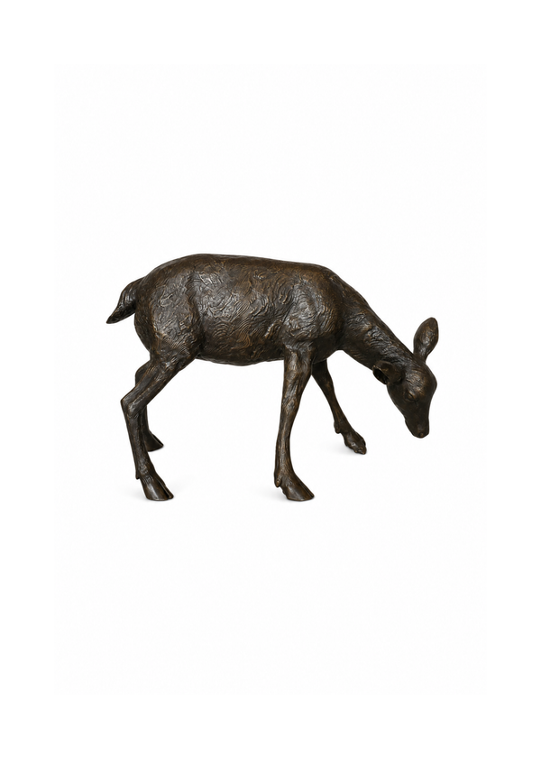 A small bronze deer figurine with a textured finish, shown in profile with its head down, set against a plain white background.