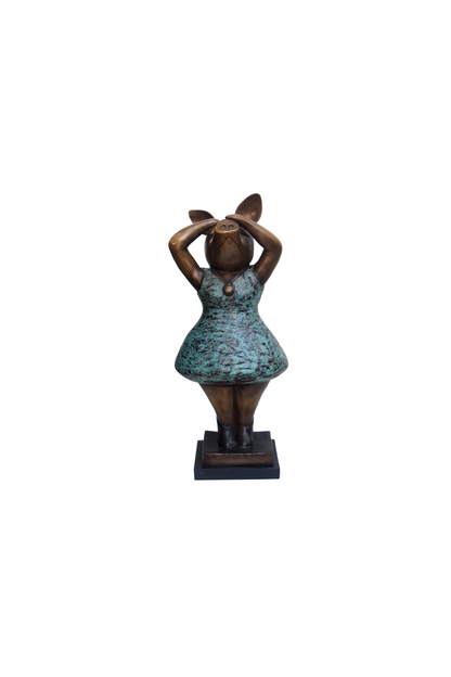 Statue of a piggy in a dress on a white background