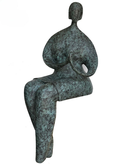 Bronze sculpture of a seated figure on a white background - luxury handmade furniture