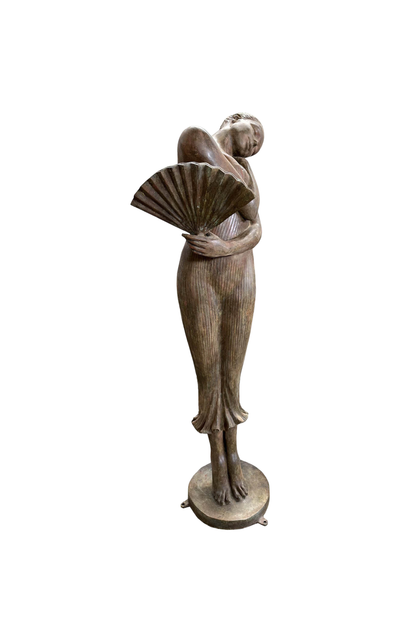 bronze Statue of a woman in a flowing dress holding a fan on a white background