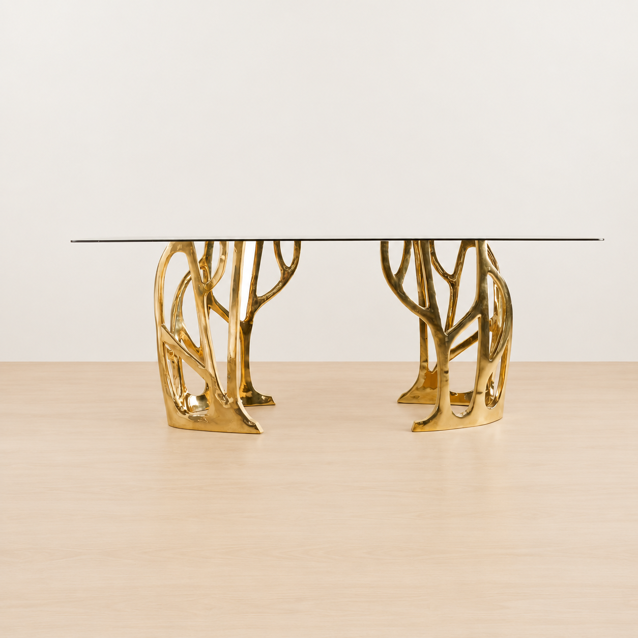 straight view of a Gold brass console table with a dark glass top