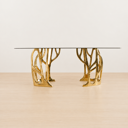 straight view of a Gold brass console table with a dark glass top