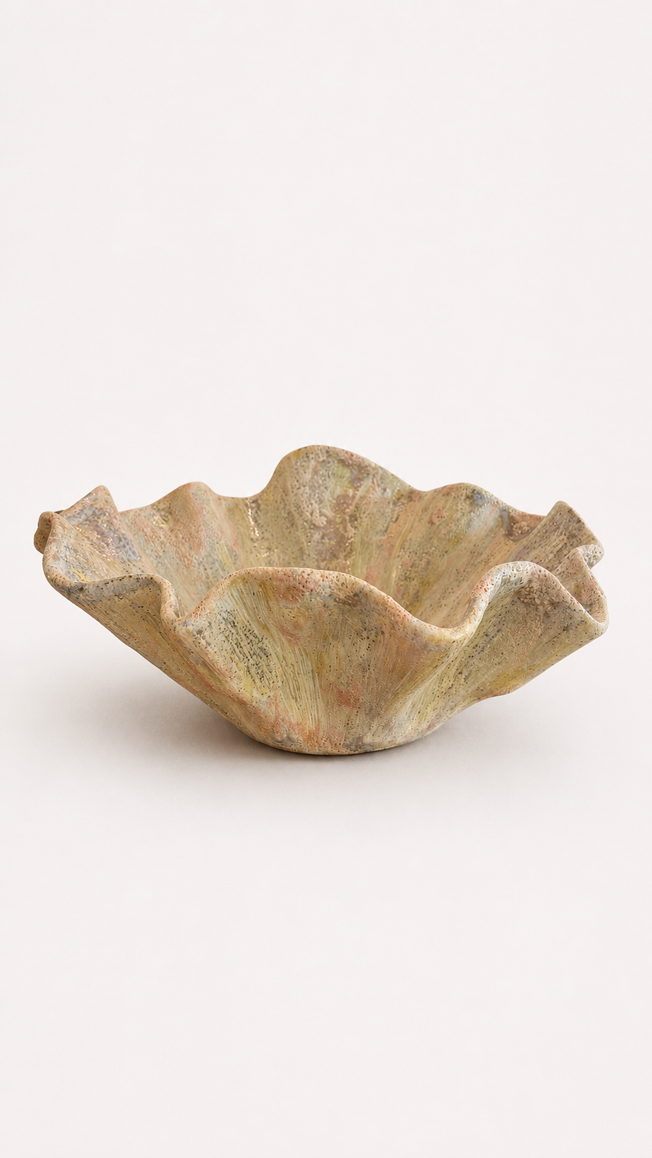Ceramic bowl with textured surface on a white background