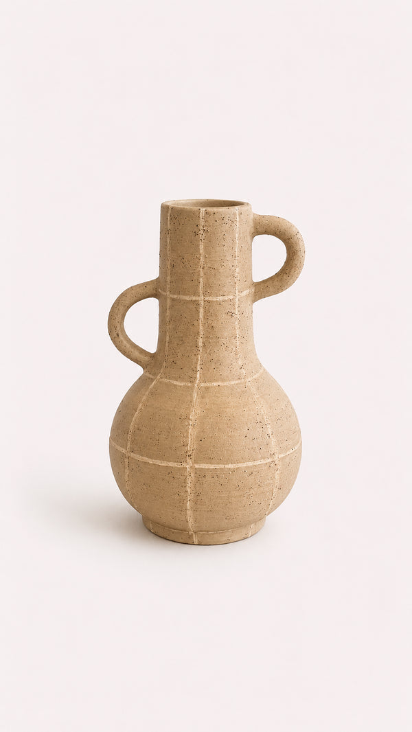Beige ceramic vase with two handles on a white background