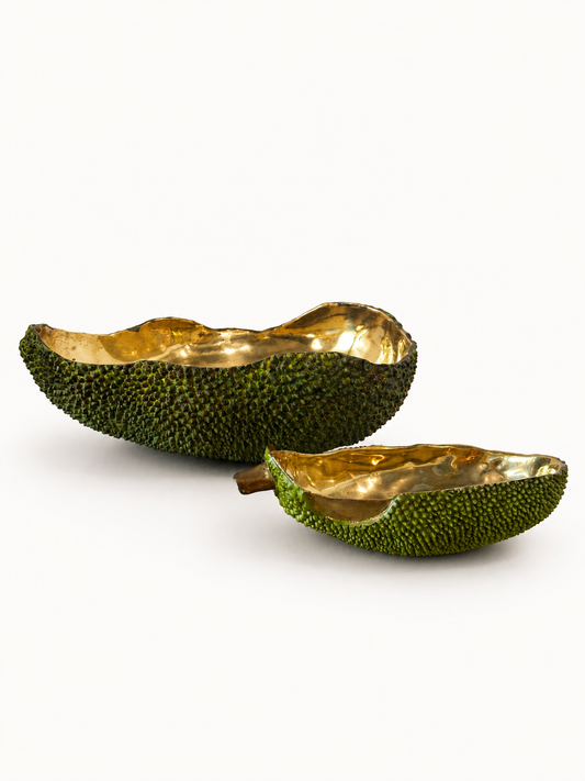 Decorative bowl shaped like an jackfruit with gold interior on a white background