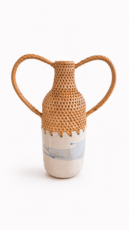 Vase with woven top and white and blue ceramic base on a white background