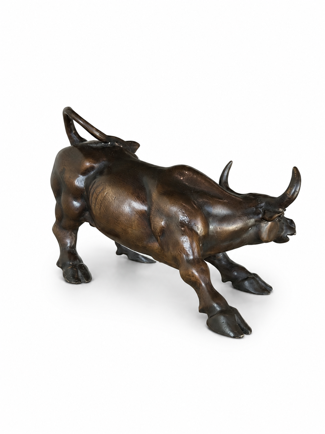back of Bronze bull sculpture on a white background 