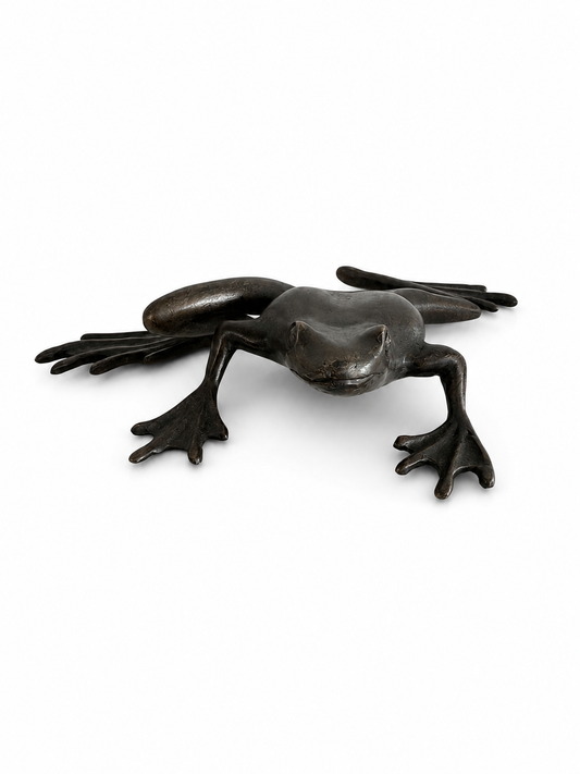 Bronze sculpture of frog about to jump on a white background