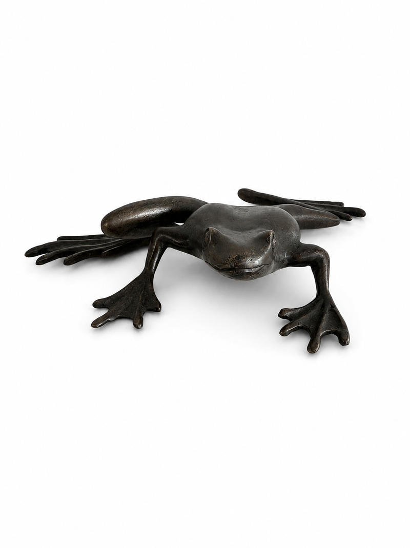 Bronze sculpture of frog about to jump on a white background